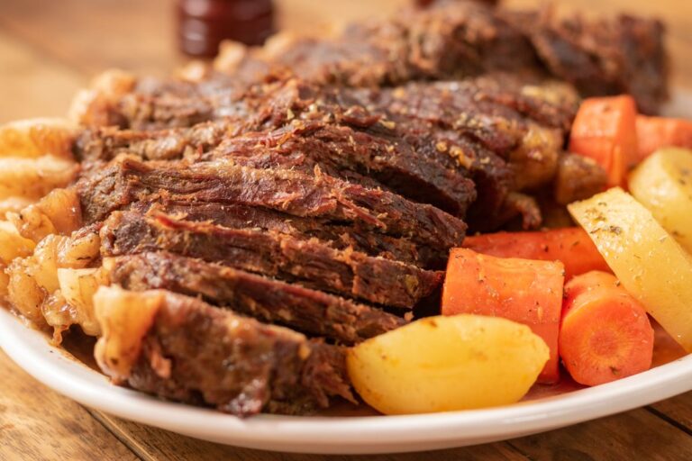 Sliced corned beef dinner with potatoes, carrots and cabbage