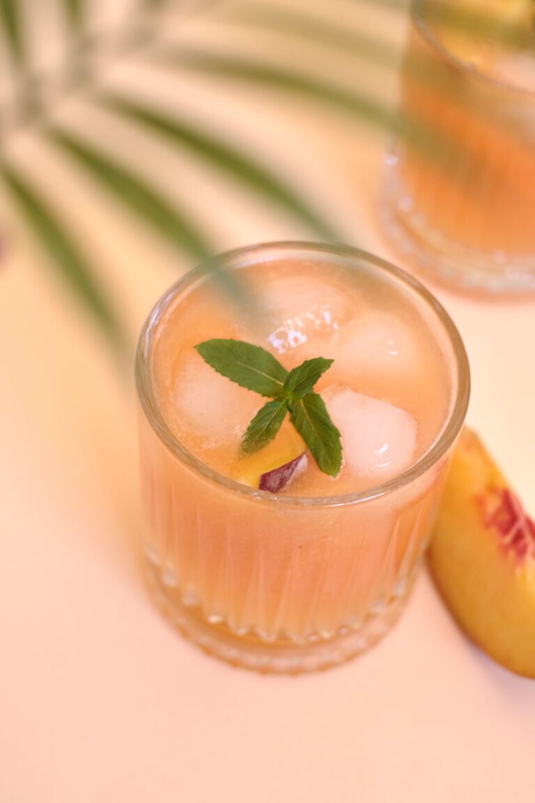 Peach moonshine in mason jars, golden and chilled